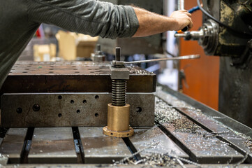 Professional metalworker at the manufacture workshop. High quality photography