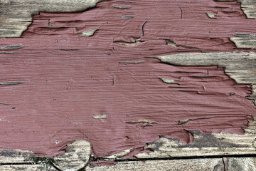 Paint flaking on old woodwork in closeup