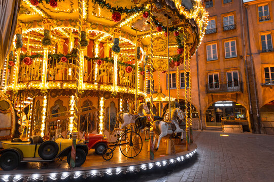 Colorful merry go round at the Saint Louise Square, Metz, France