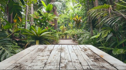 White wooden table located among lush greenery and plants