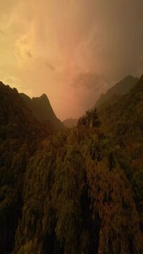 Vertical shot of the sunset over Parque Nacional Natural Tayrona in Magdalena, Colombia.