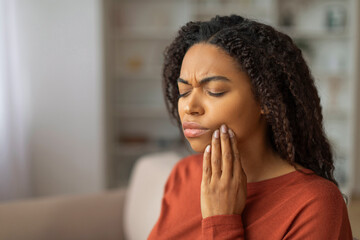 Young Black Woman Suffering From Toothache at Home