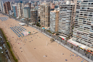 Aerial drone photo of the town of Benidorm in Spain in the summer time showing high rise apartments...