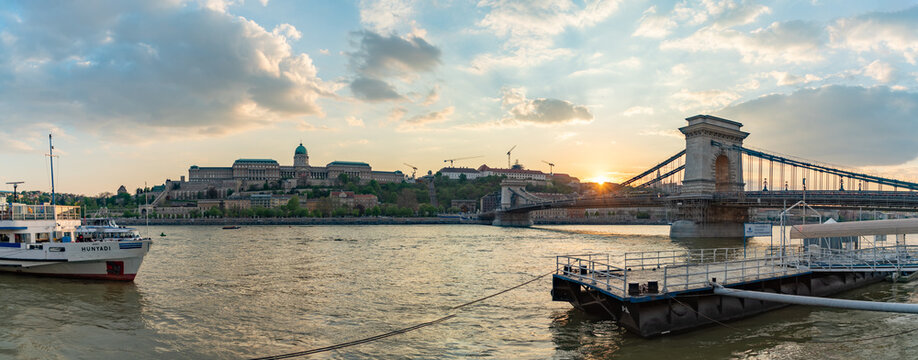 Budapest, Hungary - April 22, 2023: A picture of the Budapest Landmarks at sunset, such as the Buda Castle and the Szechenyi Chain Bridge.