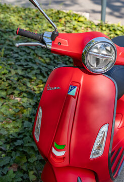Budapest, Hungary - April 23, 2023: A picture of a red Vespa scooter.