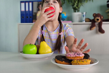 Diet or good health concept, teenage girl refuses junk food or junk food