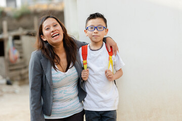 Mom with her son ready to go to school-Hispanic mom and son happy for the return to school-mom...