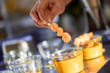 Preparing fresh organic shrimp cocktail with sauce