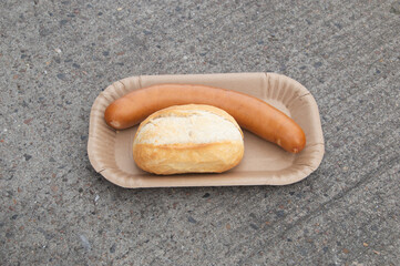 German sausage Bockwurst with roll. German street food.
