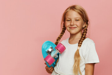 Young Girl Holding Skateboard with a Smile