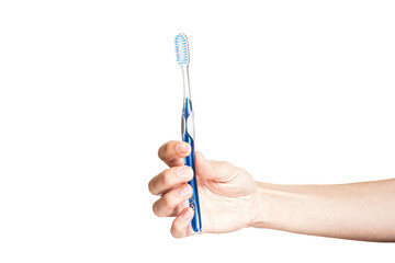 hand of a woman holding toothbrush with toothpaste isolated on white background. Female hand with...