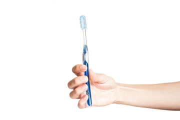 hand of a woman holding toothbrush with toothpaste isolated on white background. Female hand with blue tooth brush