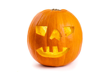 A glowing halloween pumpkin big tooth jack o lantern isolated on white