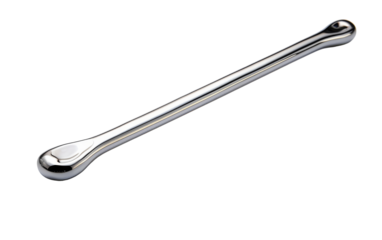 A gleaming metal spoon with a long handle resting gracefully on a pristine white background