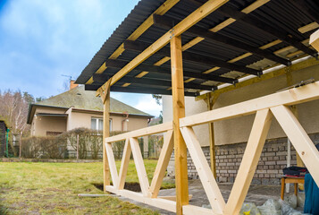 building a wooden gazebo, the side parts are made of wood. Construction concept.