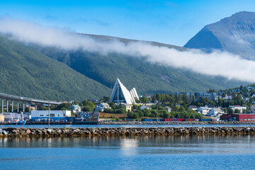 The view of Tromso with the Arctic Cathedral in Norway - obrazy, fototapety, plakaty
