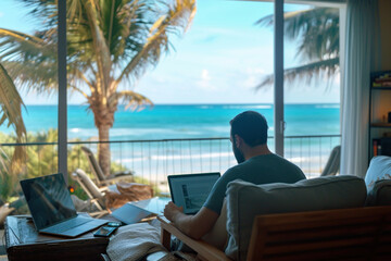 Fototapeta premium a man working at a laptop against the backdrop of a tropical beach
