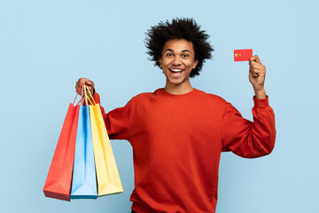 Man with shopping bags and credit card
