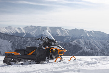 snowmobile in the winter mountains - 774348958