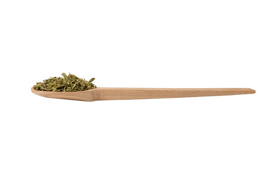 Dried leaves o Lemon verbena in latin Aloysia citrodora on wooden spoon isolated on white background. Medicinal. herb. 