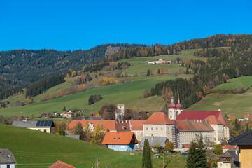 Benedictine monastery Saint Lambrecht Abbey surrounded by lush green alpine landscape in mountain...
