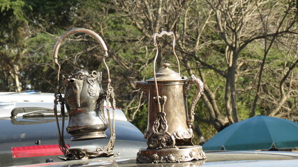 Bronze teapots at a flea market