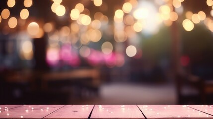 Dark background with festive, pink lights in front of a table. mockup, background or texture. space for text