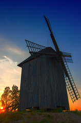 Wooden windmill, sight of sunset - 774369951