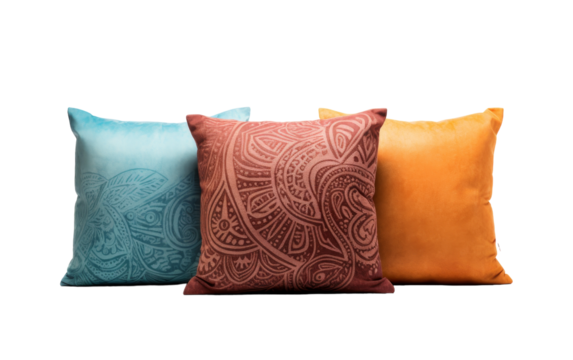 Three different colored pillows in red, blue, and yellow arranged neatly on a white background