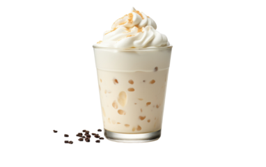 A glass of milkshake with a generous dollop of whipped cream on top