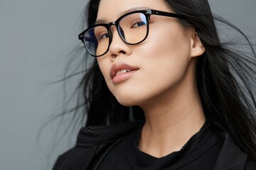 Fototapeta premium Woman smile asian glasses studio background fashion portrait beautiful