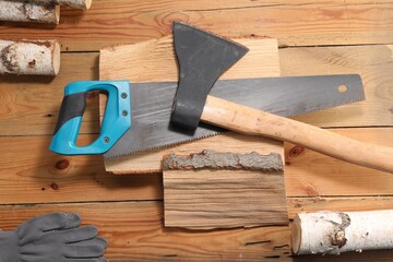 Flat lay composition with saw on wooden background