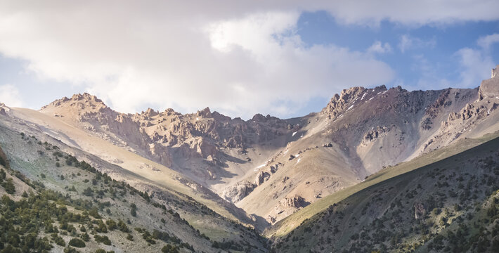 Mountain landscape of the Fan Mountains with rocks, stones, glaciers and vegetation in Tajikistan, mountain panorama