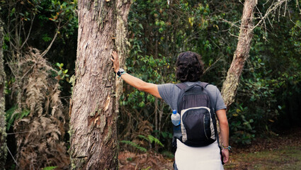 horizontal photo of young man resting in a trunk