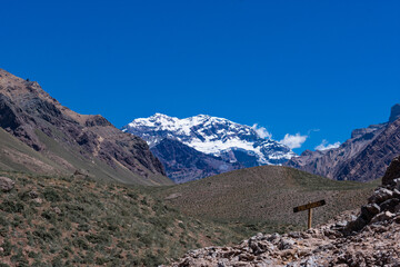 Mount Aconcagua dominating the valley, Mendoza, Argentina. Snow covered mountains in winter with a...
