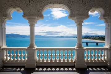 View from a beautiful white balcony with column arches and balustrade to the sea harbor and cityscape under a cloudy blue sky - obrazy, fototapety, plakaty