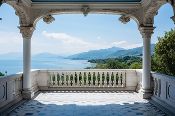 View from a beautiful white balcony with columned arches and a balustrade to the sea coast and a beautiful landscape under a cloudy blue sky