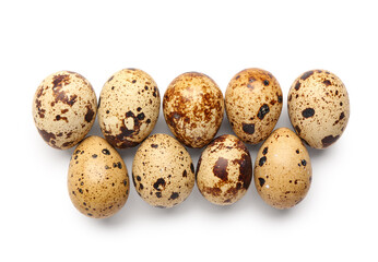 Many fresh quail eggs on white background
