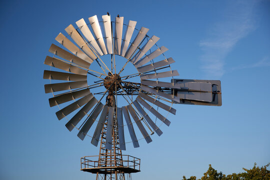 windmill used for regulationof water flow in agriculture as water pump