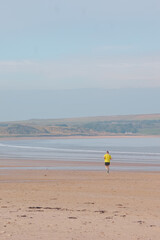 person running on beach