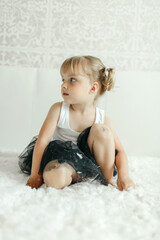 Little Girl Sitting on Floor