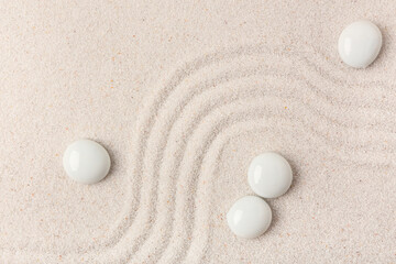 Stones on sand with lines in Japanese rock garden. Zen concept