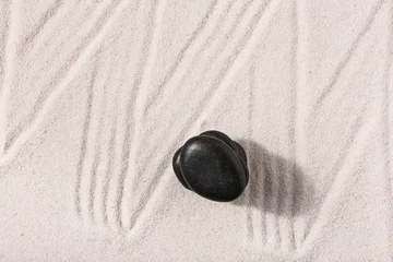 Ingelijste posters Stack of stones on sand with lines in Japanese rock garden, top view. Zen concept © Pixel-Shot