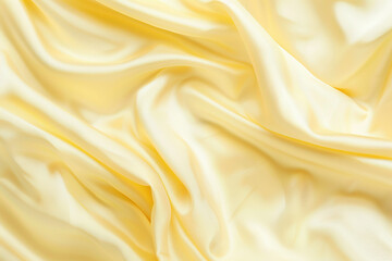 Fototapeta premium close up horizontal image of a pale yellow waves abstract silk background
