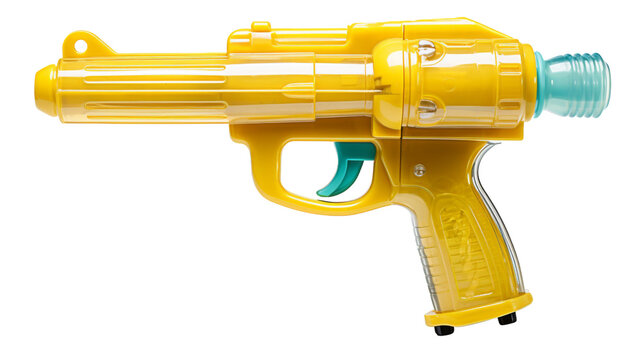 A bright yellow plastic toy gun with a green tip resting on a table