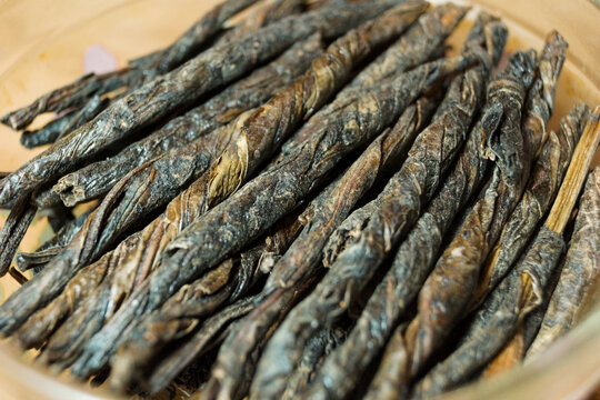 Kudin Tea Rolled Into Tubes In A Glass Bowl