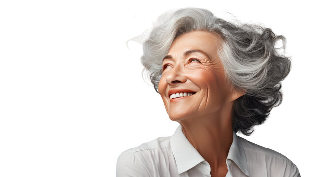 A serene older woman exudes joy in a white shirt, radiating warmth with her genuine smile