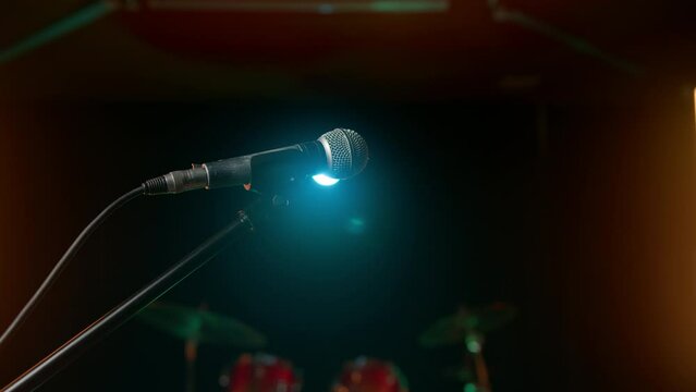 microphone on a stand in a dimly lit club, perfect for karaoke or live performances. Getting ready to engage with the crowd at a conference.