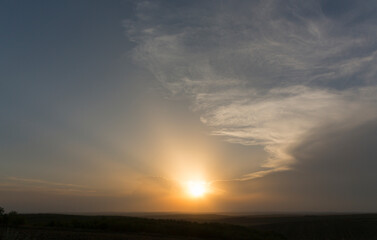 Landscape at sunset. Tragic gloomy sky. Panorama. Crimson twilight.
