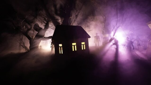 Silhouette of person standing in the dark forest with light. Horror halloween concept. strange silhouette in a dark spooky village